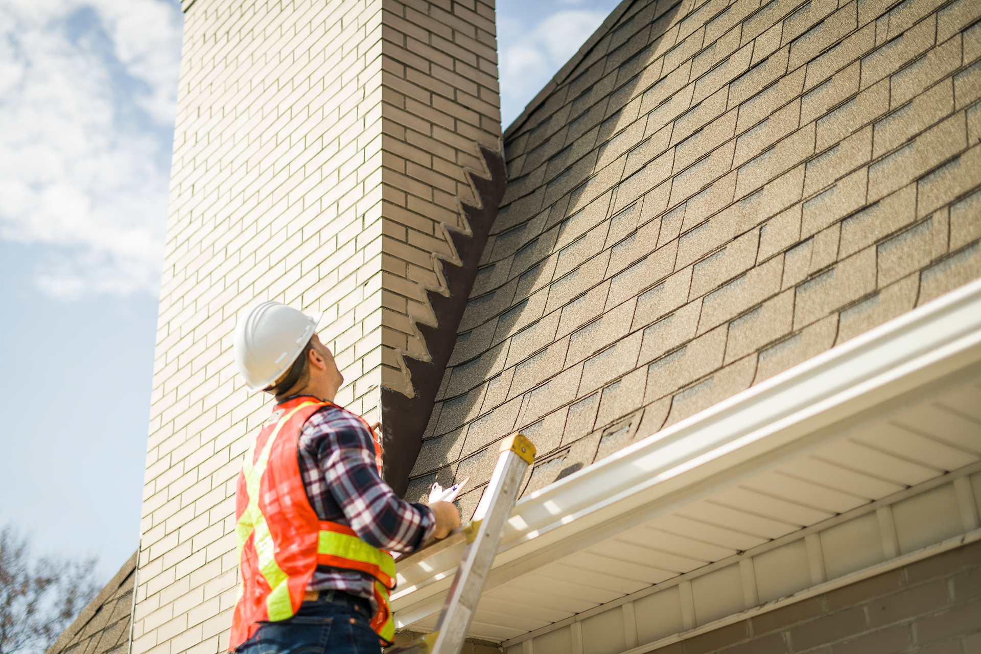 Chimney inspector performing exterior scan